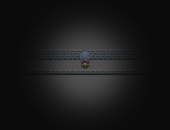 A man standing in a dark hallway that goes left to right.
